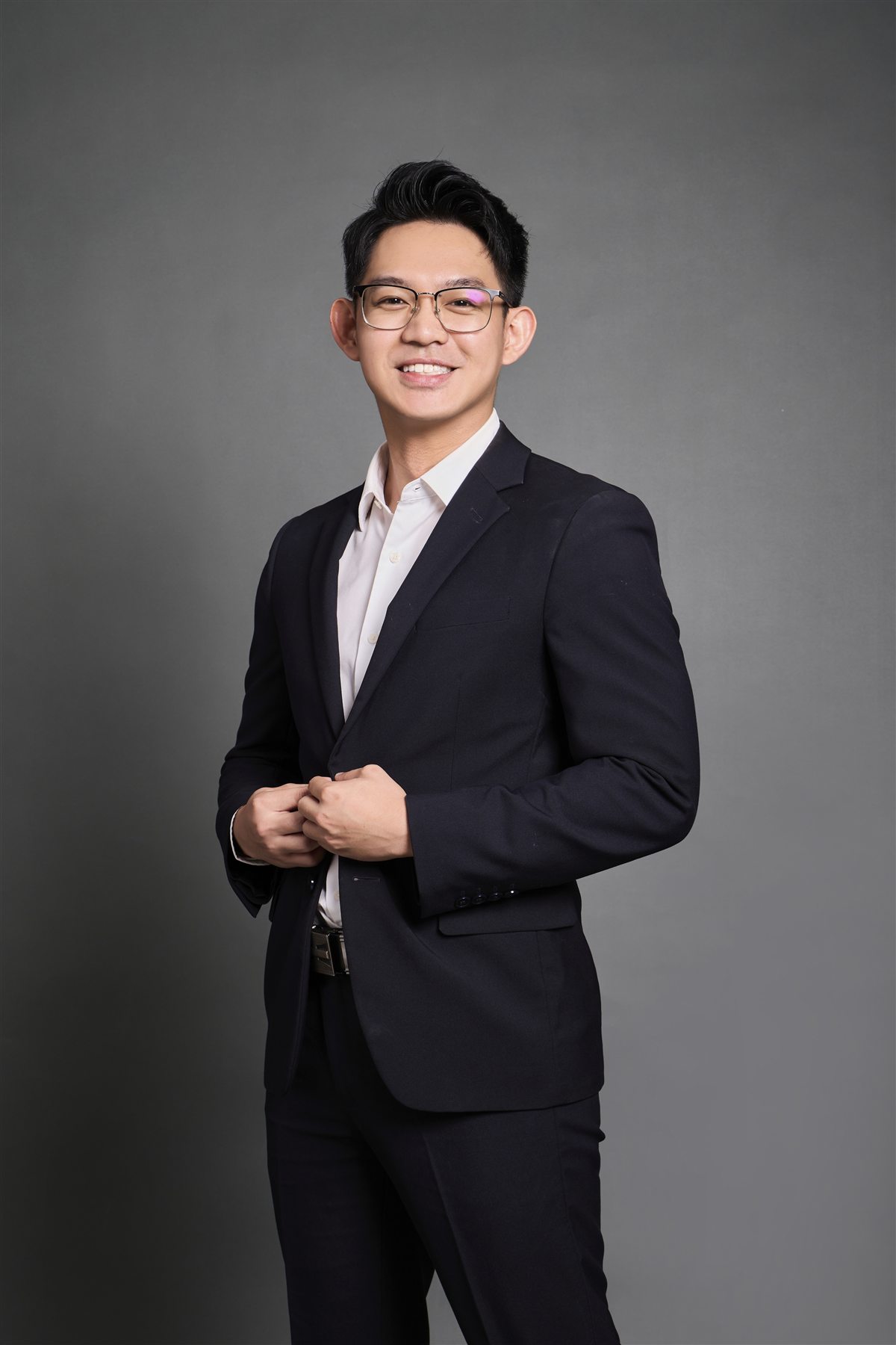 Haw Ming Jun (MJ), founder of MiraiX, in a dark suit, smiling